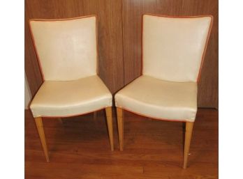 Pair Of Mid Century Modern White Vinyl Chairs With Orange Piping