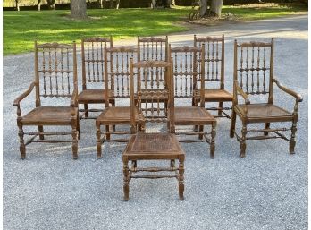 A Set Of 8 Carved Oak And Cane Seated Dining Chairs By Henredon