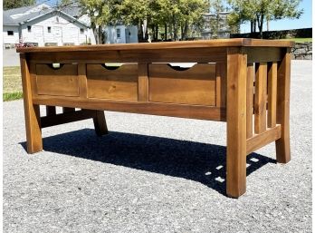 A Solid Hardwood Coffee Table With Storage Drawers