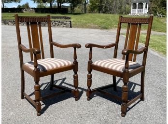 A Pair Of Vintage Carved Wood Arm Chairs