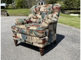 An Upholstered Armchair In Tapestry Print By Pembroke Chair Company