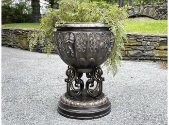 A Large Cast Acrylic And Metal Urn And Faux Floral