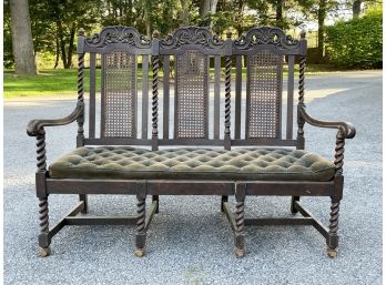 A 19th Century Oak Cane Back Bench