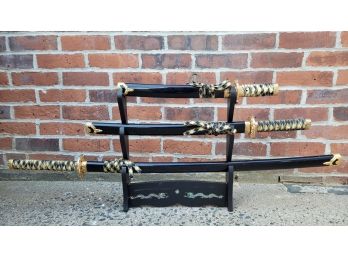 Three  Samurai Swords And Hanging Display Shelf