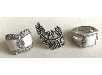 THREE STUNNING SILVER LOOK FASHION RINGS