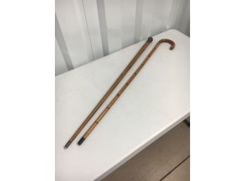 Pair Of Walking Sticks Including One With A Weighted Brass Head