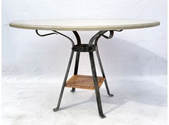 A Wrought Iron And Painted Wood Table