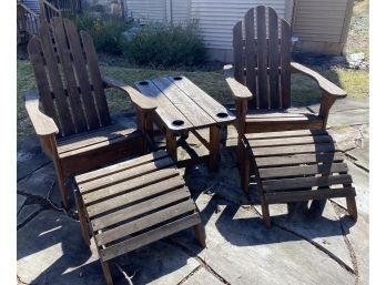 Two Adirondack Chairs, Table, And Ottomans