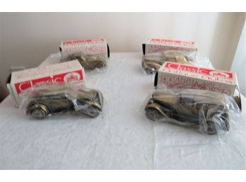 Four Cast Metal Banthrico Collectible Bank Cars Corvette Rolls