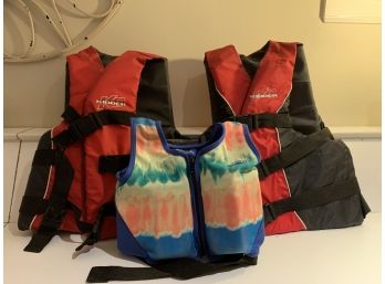 Three Life Jackets Of Mixed Sizes