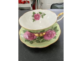 Pretty Cup And Saucer With A Crack