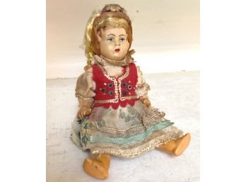 Delightful Ethnic Doll With Blond Pigtails