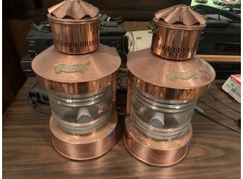 Pair Of Copper Lanterns That Hang On The Wall