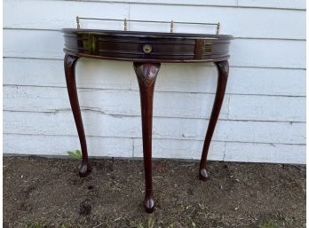 MAHOGANY GALLERIED DEMILUNE TABLE