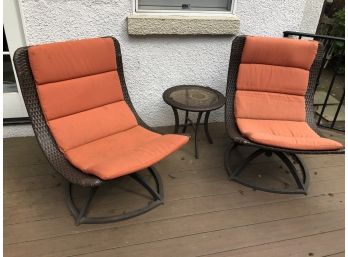 A Pair Of All Weather Woven Outdoor  Swivel Chairs With Small Table