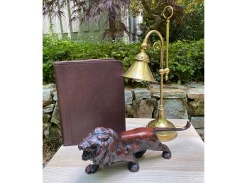 All You Need Is A Desk...Lion Sculpture, Coach Portfolio And Cool Vintage Lamp