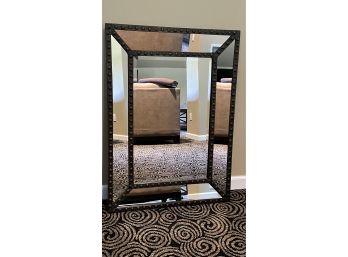 A Decorative Mirror With Metal Frame By Three Hands Corporation