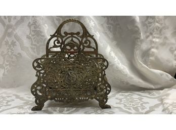 A Decorative Cast Metal  Scroll Magazine Rack Holder