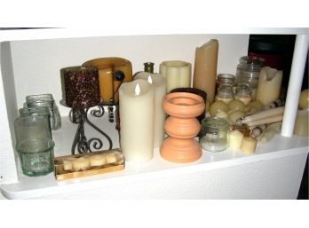 Shelf Of Candles And Candle Holders