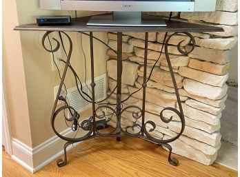 A Wrought Iron And Wood Corner Console