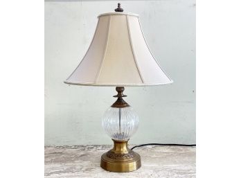 A Glass And Brass Accent Lamp