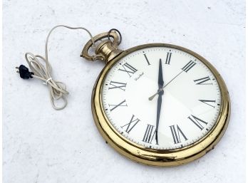 A Large Pocket Watch Form Wall Clock