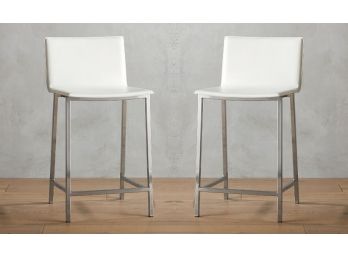 A Pair Of Leather And Chrome Bar Stools By CB2