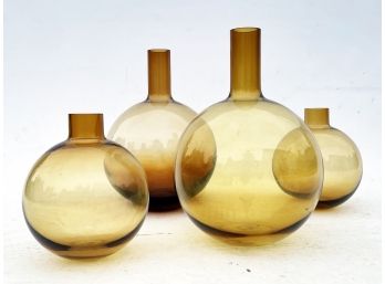 A Collection Of Modern Amber Glass Vases By West Elm