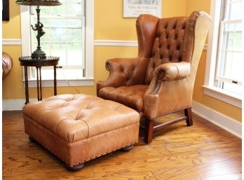 A Tufted Leather Wing Chair & Ottoman From ABC Carpet & Home