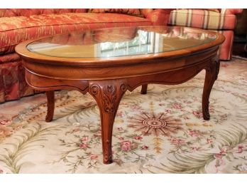 A Grained Oak Glass Top Coffee Table By Thomasville