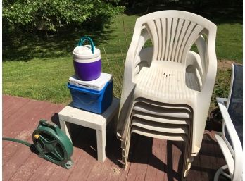 Outdoor Plastic Chairs, Cooler, And Hose