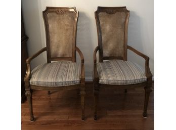 Two Vintage Wooded Arm Chairs With Cane Back And Comfortable Multicolored Padded Seats