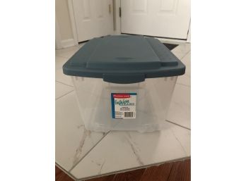 Clear Plastic Rubbermaid Storage Container With A Blue Lid