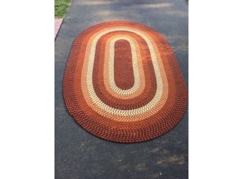 Vintage 1970s Oval Braided Rug. Oranges And Browns. 65 1/2' X 100'. In Excellent Condition. No Odors. 2 Of 2.