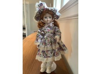 Red Headed Doll With Purple And Pink Floral Dress