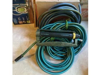 Three Garden Hose And Sprinkler