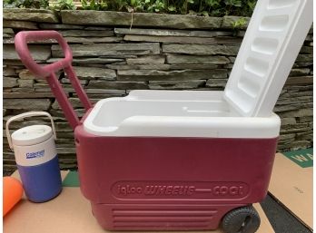 Two Coolers Or Thermos: Wine Colored With Wheels And Blue And White Drink Thermos