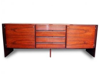 A Vintage Danish Modern Executive Rosewood Credenza With Four-centered Drawers And A Pair Of Doors