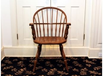 An Antique Captain's Chair In Oak