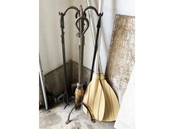 A Set Of Wrought Iron Fireplace Tools