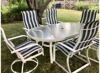 Aluminum Oval Patio Dining Table With 6 Comfy High Back Blue Chairs 2 Swivel Chairs Rippled Glass