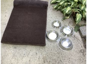 Lot Of Dog Bed And Four Dog Dishes.