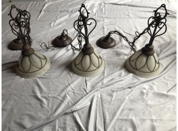 Three Beautiful Hanging Ceiling Lights With Frosted Shades And A Bronze Metal Accents