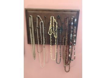 13 Costume Jewelry Necklaces On A Peg Board