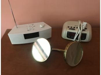Two Alarm Clock Radios And Mirror