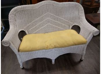 White Wicker Loveseat With Light Yellow Cushion