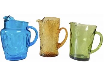 A Collection Of Three Vintage Glass Pitchers