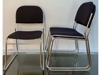 Three Bent Chrome Stack Chairs