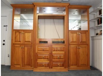 A Custom Setback Lighted Wall Unit In Light Maple