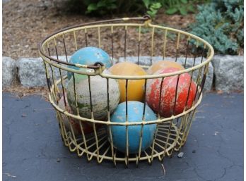 A Vintage Wire Basket With Polo Balls